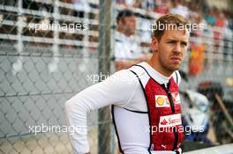 Sebastian Vettel (GER) Ferrari on the grid. 29.03.2015. Formula 1 World Championship, Rd 2, Malaysian Grand Prix, Sepang, Malaysia, Sunday.