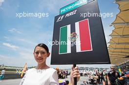 Grid girl for Sergio Perez (MEX) Sahara Force India F1. 29.03.2015. Formula 1 World Championship, Rd 2, Malaysian Grand Prix, Sepang, Malaysia, Sunday.