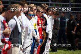 Kimi Raikkonen (FIN) Ferrari with the drivers as the grid observes the national anthem. 29.03.2015. Formula 1 World Championship, Rd 2, Malaysian Grand Prix, Sepang, Malaysia, Sunday.
