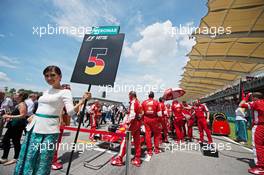 Grid girl for Sebastian Vettel (GER) Ferrari. 29.03.2015. Formula 1 World Championship, Rd 2, Malaysian Grand Prix, Sepang, Malaysia, Sunday.