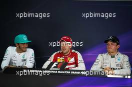 The post race FIA Press Conference (L to R): Lewis Hamilton (GBR) Mercedes AMG F1, second; Sebastian Vettel (GER) Ferrari, race winner; Nico Rosberg (GER) Mercedes AMG F1, third. 29.03.2015. Formula 1 World Championship, Rd 2, Malaysian Grand Prix, Sepang, Malaysia, Sunday.