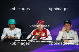 The post race FIA Press Conference (L to R): Lewis Hamilton (GBR) Mercedes AMG F1, second; Sebastian Vettel (GER) Ferrari, race winner; Nico Rosberg (GER) Mercedes AMG F1, third. 29.03.2015. Formula 1 World Championship, Rd 2, Malaysian Grand Prix, Sepang, Malaysia, Sunday.