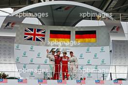 The podium (L to R): Lewis Hamilton (GBR) Mercedes AMG F1, second; Diego Ioverno (ITA) Ferrari Operations Director; Sebastian Vettel (GER) Ferrari, race winner; Nico Rosberg (GER) Mercedes AMG F1, third. 29.03.2015. Formula 1 World Championship, Rd 2, Malaysian Grand Prix, Sepang, Malaysia, Sunday.