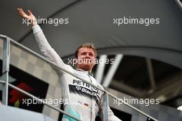 Nico Rosberg (GER) Mercedes AMG F1 celebrates his third position on the podium. 29.03.2015. Formula 1 World Championship, Rd 2, Malaysian Grand Prix, Sepang, Malaysia, Sunday.