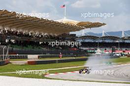Daniil Kvyat (RUS) Red Bull Racing RB11 locks up under braking. 29.03.2015. Formula 1 World Championship, Rd 2, Malaysian Grand Prix, Sepang, Malaysia, Sunday.