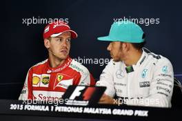 (L to R): Sebastian Vettel (GER) Ferrari and Lewis Hamilton (GBR) Mercedes AMG F1 in the FIA Press Conference. 28.03.2015. Formula 1 World Championship, Rd 2, Malaysian Grand Prix, Sepang, Malaysia, Saturday.