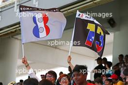 Lotus F1 Team fans with flags. 29.03.2015. Formula 1 World Championship, Rd 2, Malaysian Grand Prix, Sepang, Malaysia, Sunday.