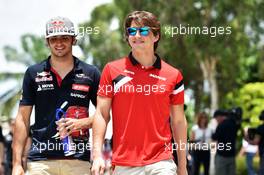 (L to R): Carlos Sainz Jr (ESP) Scuderia Toro Rosso with Roberto Merhi (ESP) Manor Marussia F1 Team. 29.03.2015. Formula 1 World Championship, Rd 2, Malaysian Grand Prix, Sepang, Malaysia, Sunday.