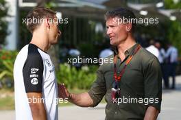 (L to R): Jenson Button (GBR) McLaren with David Coulthard (GBR) Red Bull Racing and Scuderia Toro Advisor / BBC Television Commentator. 26.03.2015. Formula 1 World Championship, Rd 2, Malaysian Grand Prix, Sepang, Malaysia, Thursday.