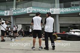 (L to R): Fernando Alonso (ESP) McLaren with Andrea Stella (ITA) McLaren Race Engineer. 26.03.2015. Formula 1 World Championship, Rd 2, Malaysian Grand Prix, Sepang, Malaysia, Thursday.