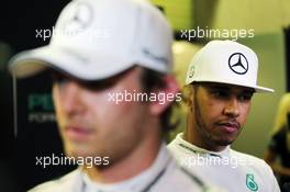 (L to R): Nico Rosberg (GER) Mercedes AMG F1 with team mate Lewis Hamilton (GBR) Mercedes AMG F1. 27.11.2015. Formula 1 World Championship, Rd 19, Abu Dhabi Grand Prix, Yas Marina Circuit, Abu Dhabi, Practice Day.
