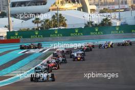Nico Rosberg (GER) Mercedes AMG F1 W06 leads at the start of the race as Pastor Maldonado (VEN) Lotus F1 E23 and Fernando Alonso (ESP) McLaren MP4-30 leave the track. 29.11.2015. Formula 1 World Championship, Rd 19, Abu Dhabi Grand Prix, Yas Marina Circuit, Abu Dhabi, Race Day.