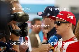 Kimi Raikkonen (FIN) Ferrari with the media. 26.11.2015. Formula 1 World Championship, Rd 19, Abu Dhabi Grand Prix, Yas Marina Circuit, Abu Dhabi, Preparation Day.