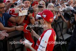 Sebastian Vettel (GER) Ferrari signs autographs for the fans. 26.11.2015. Formula 1 World Championship, Rd 19, Abu Dhabi Grand Prix, Yas Marina Circuit, Abu Dhabi, Preparation Day.