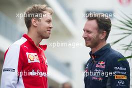 (L to R): Sebastian Vettel (GER) Ferrari with Christian Horner (GBR) Red Bull Racing Team Principal. 23.10.2015. Formula 1 World Championship, Rd 16, United States Grand Prix, Austin, Texas, USA, Practice Day.