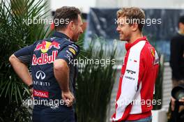 (L to R): Christian Horner (GBR) Red Bull Racing Team Principal with Sebastian Vettel (GER) Ferrari. 23.10.2015. Formula 1 World Championship, Rd 16, United States Grand Prix, Austin, Texas, USA, Practice Day.