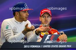(L to R): Lewis Hamilton (GBR) Mercedes AMG F1 with Sebastian Vettel (GER) Ferrari in the FIA Press Conference. 25.10.2015. Formula 1 World Championship, Rd 16, United States Grand Prix, Austin, Texas, USA, Race Day.