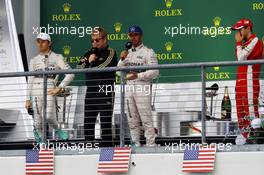 The podium (L to R): Nico Rosberg (GER) Mercedes AMG F1, second; Sir Elton John (GBR);  Lewis Hamilton (GBR) Mercedes AMG F1, race winner and World Champion; Sebastian Vettel (GER) Ferrari, third. 25.10.2015. Formula 1 World Championship, Rd 16, United States Grand Prix, Austin, Texas, USA, Race Day.