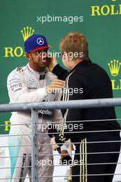 The podium (L to R): Race winner and World Champion Lewis Hamilton (GBR) Mercedes AMG F1 with Sir Elton John (GBR) 25.10.2015. Formula 1 World Championship, Rd 16, United States Grand Prix, Austin, Texas, USA, Race Day.