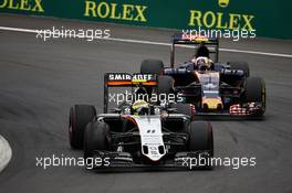 Sergio Perez (MEX) Sahara Force India F1 VJM09 and Carlos Sainz Jr (ESP) Scuderia Toro Rosso STR11. 03.07.2016. Formula 1 World Championship, Rd 9, Austrian Grand Prix, Spielberg, Austria, Race Day.