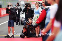 Photograhpers on the drivers parade (L to R): Mark Thompson (GBR); Mario Renzi (ITA); Peter J Fox (GBR); and Darren Heath (GBR). 03.07.2016. Formula 1 World Championship, Rd 9, Austrian Grand Prix, Spielberg, Austria, Race Day.