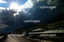 The sun behind dark clouds over the circuit. 30.06.2016. Formula 1 World Championship, Rd 9, Austrian Grand Prix, Spielberg, Austria, Preparation Day.