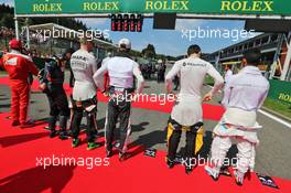 (L to R): Nico Hulkenberg (GER) Sahara Force India F1; Romain Grosjean (FRA) Haas F1 Team; Jolyon Palmer (GBR) Renault Sport F1 Team; and Pascal Wehrlein (GER) Manor Racing, as the grid observes the national anthem. 28.08.2016. Formula 1 World Championship, Rd 13, Belgian Grand Prix, Spa Francorchamps, Belgium, Race Day.