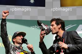 (L to R): Daniel Ricciardo (AUS) Red Bull Racing celebrates his second position on the podium with Mark Webber (AUS) Porsche Team WEC Driver / Channel 4 Presenter, who drinks champagne from Daniel's race boot. 28.08.2016. Formula 1 World Championship, Rd 13, Belgian Grand Prix, Spa Francorchamps, Belgium, Race Day.