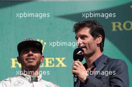 (L to R): Lewis Hamilton (GBR) Mercedes AMG F1 on the podium with Mark Webber (AUS) Porsche Team WEC Driver / Channel 4 Presenter. 28.08.2016. Formula 1 World Championship, Rd 13, Belgian Grand Prix, Spa Francorchamps, Belgium, Race Day.