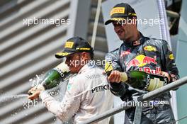 (L to R): third placed Lewis Hamilton (GBR) Mercedes AMG F1 and second placed Daniel Ricciardo (AUS) Red Bull Racing celebrate with the champagne on the podium. 28.08.2016. Formula 1 World Championship, Rd 13, Belgian Grand Prix, Spa Francorchamps, Belgium, Race Day.