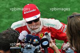Kimi Raikkonen (FIN) Ferrari with the media. 28.08.2016. Formula 1 World Championship, Rd 13, Belgian Grand Prix, Spa Francorchamps, Belgium, Race Day.