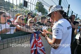 Lewis Hamilton (GBR) Mercedes AMG F1 signs autographs for the fans. 25.08.2016. Formula 1 World Championship, Rd 13, Belgian Grand Prix, Spa Francorchamps, Belgium, Preparation Day.