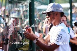Lewis Hamilton (GBR) Mercedes AMG F1 signs autographs for the fans. 25.08.2016. Formula 1 World Championship, Rd 13, Belgian Grand Prix, Spa Francorchamps, Belgium, Preparation Day.
