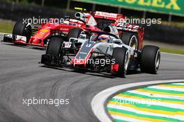 Romain Grosjean (FRA) Haas F1 Team VF-16 and Kimi Raikkonen (FIN) Ferrari SF16-H with Halo cockpit covers. 11.11.2016. Formula 1 World Championship, Rd 20, Brazilian Grand Prix, Sao Paulo, Brazil, Practice Day.
