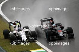 (L to R): Valtteri Bottas (FIN) Williams FW38 and Fernando Alonso (ESP) McLaren MP4-31 battle for position. 13.11.2016. Formula 1 World Championship, Rd 20, Brazilian Grand Prix, Sao Paulo, Brazil, Race Day.