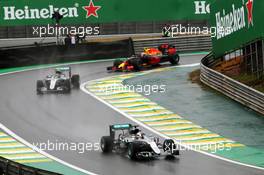 Lewis Hamilton (GBR) Mercedes AMG F1 W07 Hybrid leads team mate Nico Rosberg (GER) Mercedes AMG F1 W07 Hybrid and Max Verstappen (NLD) Red Bull Racing RB12 out of the pits. 13.11.2016. Formula 1 World Championship, Rd 20, Brazilian Grand Prix, Sao Paulo, Brazil, Race Day.