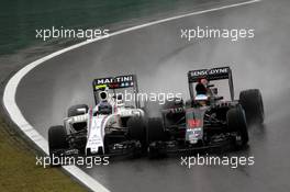 (L to R): Valtteri Bottas (FIN) Williams FW38 and Fernando Alonso (ESP) McLaren MP4-31 battle for position. 13.11.2016. Formula 1 World Championship, Rd 20, Brazilian Grand Prix, Sao Paulo, Brazil, Race Day.