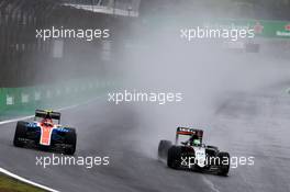 (L to R): Esteban Ocon (FRA) Manor Racing MRT05 and Nico Hulkenberg (GER) Sahara Force India F1 VJM09 battle for position. 13.11.2016. Formula 1 World Championship, Rd 20, Brazilian Grand Prix, Sao Paulo, Brazil, Race Day.