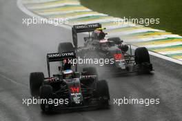 Fernando Alonso (ESP) McLaren MP4-31 leads team mate Jenson Button (GBR) McLaren MP4-31. 13.11.2016. Formula 1 World Championship, Rd 20, Brazilian Grand Prix, Sao Paulo, Brazil, Race Day.