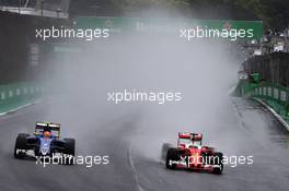 (L to R): Felipe Nasr (BRA) Sauber C35 and Sebastian Vettel (GER) Ferrari SF16-H battle for position. 13.11.2016. Formula 1 World Championship, Rd 20, Brazilian Grand Prix, Sao Paulo, Brazil, Race Day.