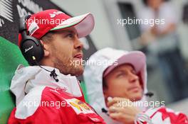 Sebastian Vettel (GER) Ferrari with team mate Kimi Raikkonen (FIN) Ferrari on the drivers parade. 13.11.2016. Formula 1 World Championship, Rd 20, Brazilian Grand Prix, Sao Paulo, Brazil, Race Day.