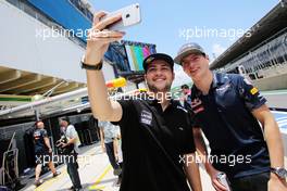 (L to R): Felipe Fraga (BRA) Stock Car Driver with Max Verstappen (NLD) Red Bull Racing. 10.11.2016. Formula 1 World Championship, Rd 20, Brazilian Grand Prix, Sao Paulo, Brazil, Preparation Day.