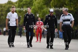 (L to R): Jenson Button (GBR) McLaren with Stoffel Vandoorne (BEL) McLaren Test and Reserve Driver and Fernando Alonso (ESP) McLaren. 15.04.2016. Formula 1 World Championship, Rd 3, Chinese Grand Prix, Shanghai, China, Practice Day.