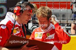 Sebastian Vettel (GER) Ferrari on the grid. 17.04.2016. Formula 1 World Championship, Rd 3, Chinese Grand Prix, Shanghai, China, Race Day.