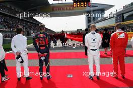 Max Verstappen (NLD) Scuderia Toro Rosso and Valtteri Bottas (FIN) Williams as the grid observes the national anthem. Lewis Hamilton (GBR) Mercedes AMG F1 is missing. 17.04.2016. Formula 1 World Championship, Rd 3, Chinese Grand Prix, Shanghai, China, Race Day.