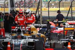 (L to R): Kimi Raikkonen (FIN) Ferrari with team mate Sebastian Vettel (GER) Ferrari in parc ferme. 17.04.2016. Formula 1 World Championship, Rd 3, Chinese Grand Prix, Shanghai, China, Race Day.