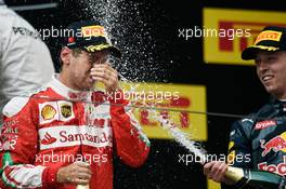 Sebastian Vettel (GER) Ferrari celebrates his second position on the podium. 17.04.2016. Formula 1 World Championship, Rd 3, Chinese Grand Prix, Shanghai, China, Race Day.
