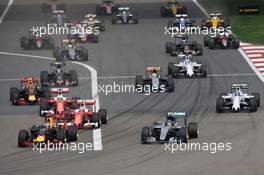 (L to R): Daniel Ricciardo (AUS) Red Bull Racing RB12 and Nico Rosberg (GER) Mercedes AMG F1 W07 Hybrid lead at the start of the race. 17.04.2016. Formula 1 World Championship, Rd 3, Chinese Grand Prix, Shanghai, China, Race Day.