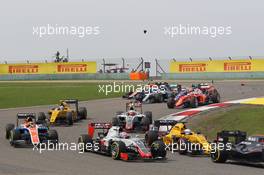 Romain Grosjean (FRA) Haas F1 Team VF-16 at the start of the race as Lewis Hamilton (GBR) Mercedes AMG F1 W07 Hybrid and Kimi Raikkonen (FIN) Ferrari SF16-H race with broken front wings. 17.04.2016. Formula 1 World Championship, Rd 3, Chinese Grand Prix, Shanghai, China, Race Day.