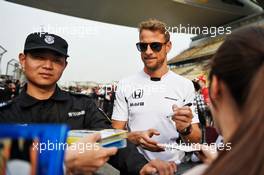 Jenson Button (GBR) McLaren signs autographs for the fans. 14.04.2016. Formula 1 World Championship, Rd 3, Chinese Grand Prix, Shanghai, China, Preparation Day.